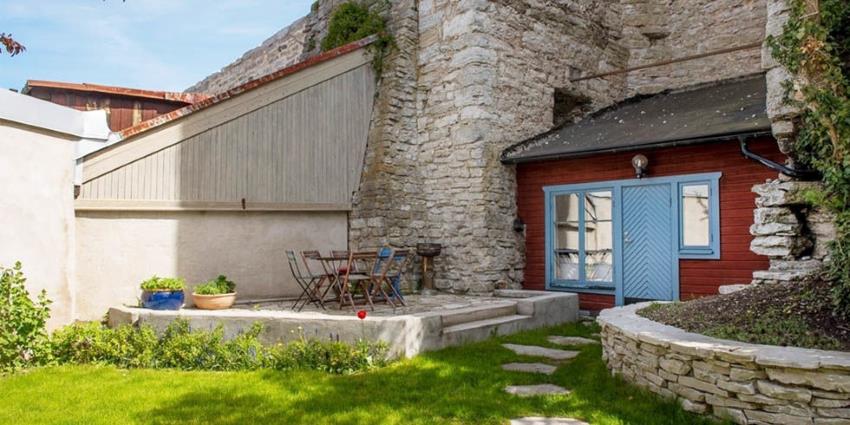 A 538 square foot cottage in Sweden, built into medieval walls.